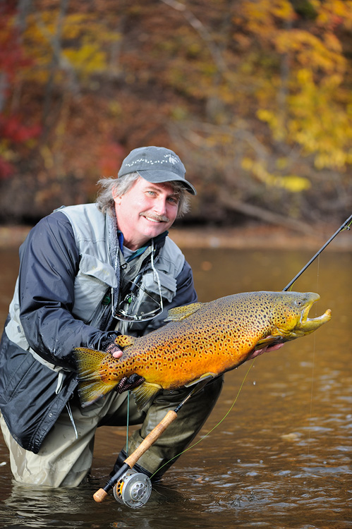 Graham Owen with a huge orange colored brown trout