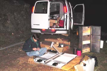 Dave Greathouse wiring panels in the dark