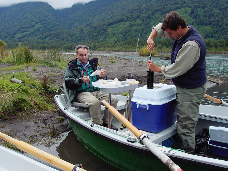 Jim's Guide opening a bottle of wine with lunch