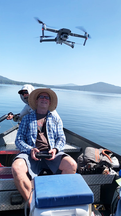 Tim Rajeff launching a drone from the boat