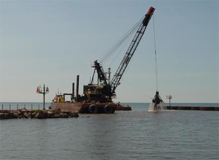 A big dredge clearing the Oak Orchard creek boat channel