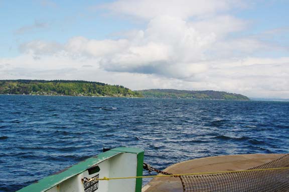 standing at the front of the Vaschon Island ferry