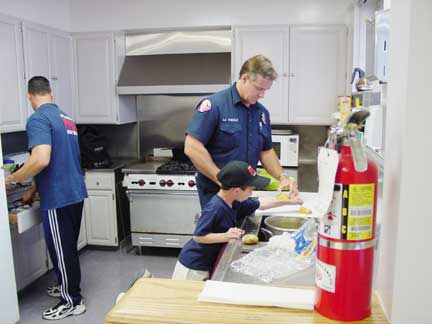 cooking dinner in the fire station - chicken, mashed pototo's and corn
