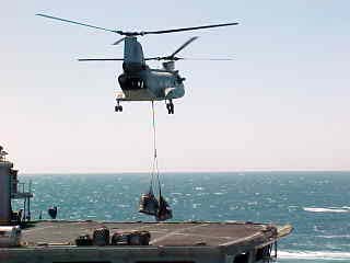 US carrier based helicopter transporting equipment