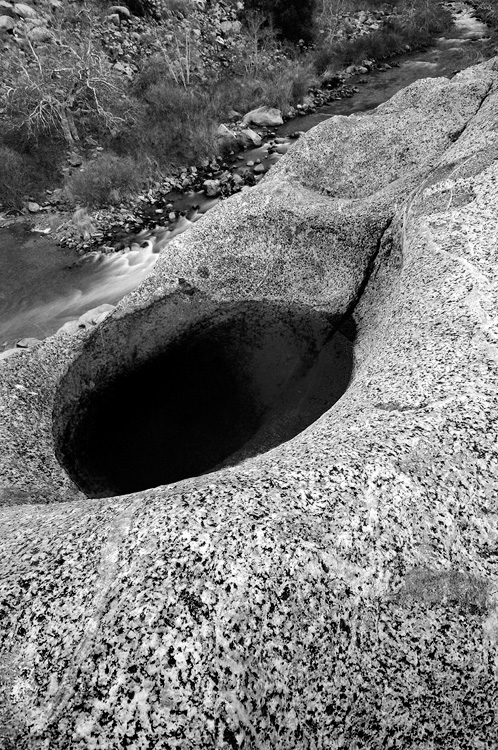 Kern River and boulder with a rain filled pocket of water