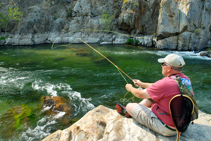 Fly fisherman fly fishing the Kern River with a custom bamboo fly rod